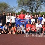 В преддверии Дня физкультурника в Алчевске состоялось тематическое мероприятие «Зарядка с чемпионом»